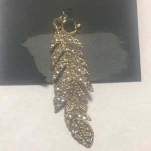Macy’s I N C gold feather charm